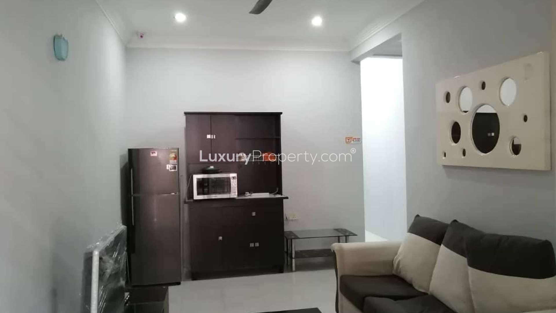 Alt text: "Study area in furnished 5-bedroom terrace house, Taman Bukit Indah, Johor Bahru.",Fully furnished living area in 5-bedroom terrace house, Taman Bukit Indah, Johor Bahru